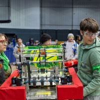Students moving their robot to the field